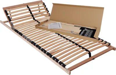 A wooden bed frame with adjustable headrest, shown partially assembled with its packaging and instructions.
