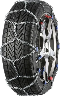 A snow chain is mounted on a car tire.