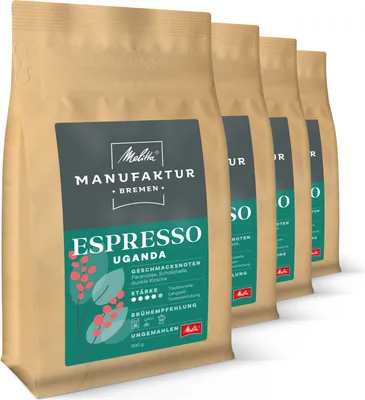 Multiple bags of Melitta Manufaktur Espresso Uganda coffee beans are lined up.
