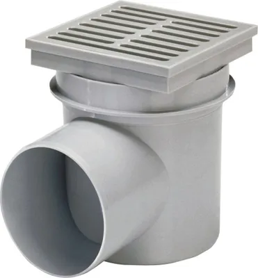 A gray floor drain with a grate on top and a side outlet.