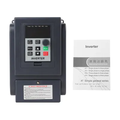 A variable frequency inverter and its operating manual are displayed against a white background.