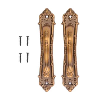 Two ornate bronze door handles and four screws on a white background.