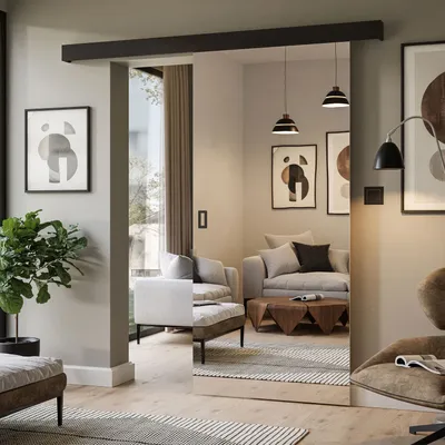 A modern living room with a sliding door and mirror, featuring furniture and decor.