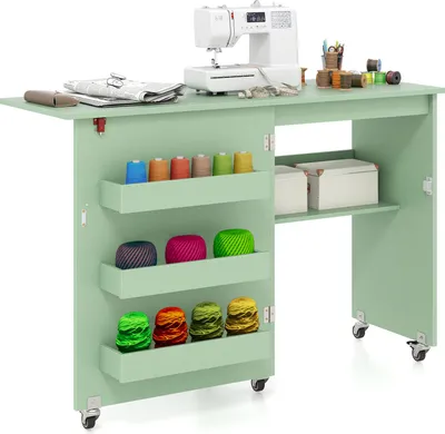 A sewing table with a sewing machine and various sewing supplies.