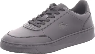 A single black Lacoste sneaker shown from a side-diagonal angle against a white background.