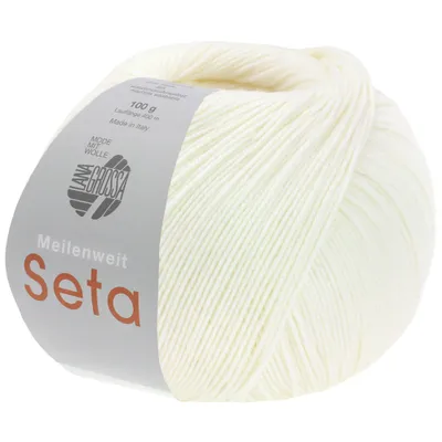 A ball of white yarn with a label.