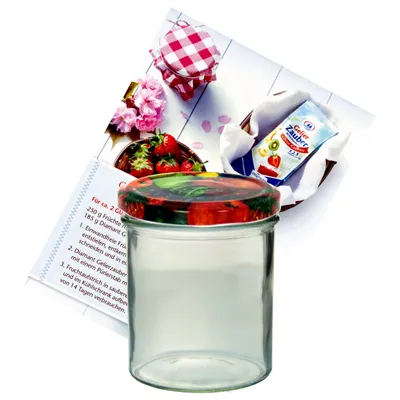 A glass jar with a decorative lid, a recipe booklet, and a packet of jam-making ingredients are arranged on a white background.