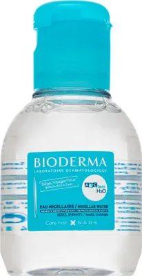 A clear studio shot of a small bottle of Bioderma micellar water with a blue cap.