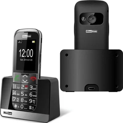 A black Maxcom senior-friendly mobile phone and its charging dock are displayed against a white background.