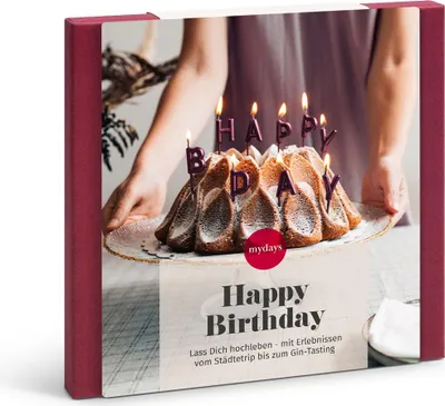 A gift box for a birthday with a cake and candles.