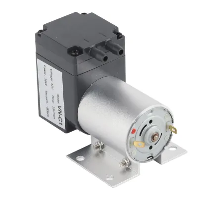 A vacuum pump with a motor and a stand, isolated on a white background.