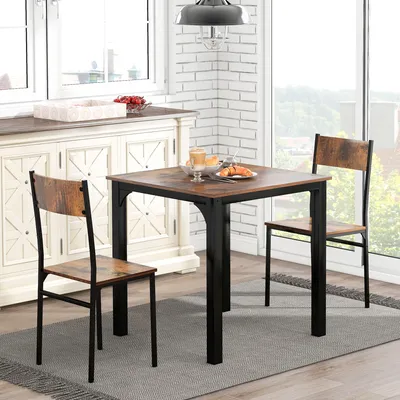 A dining set with a table and two chairs in a dining room.