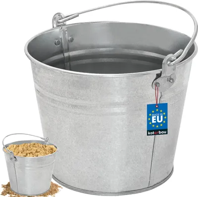 A galvanized metal bucket with a handle, and a smaller bucket filled with sand in the foreground.