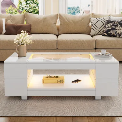 Zdjęcie produktu dla Stolik kawowy o wymiarach 100 x 50 x 35 cm, wykonany w 100% z płyty wiórowej, z hartowanym szkłem, w kolorze białym, wyposażony w oświetlenie LED, sterowanie za pomocą aplikacji oraz dwie półki