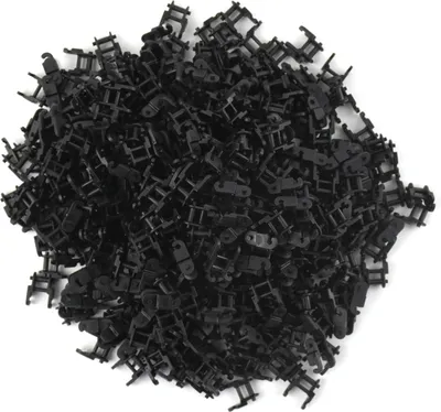 A pile of small black plastic chain links.