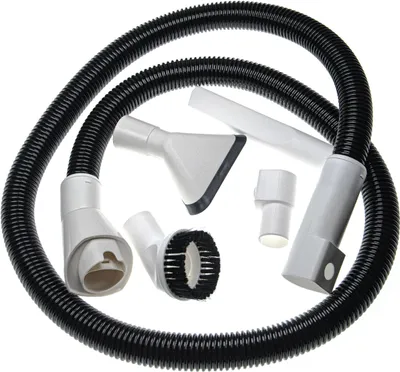 A set of vacuum cleaner attachments and a flexible hose are arranged in a circular pattern against a white background.