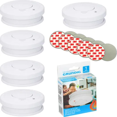A collage of smoke detectors, adhesive pads, and a product box.