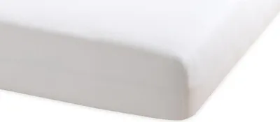 A close-up view of a white fitted sheet, showing the corner and a portion of the top surface.
