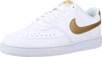 A white Nike Court Vision Lo NN shoe with gold accents.