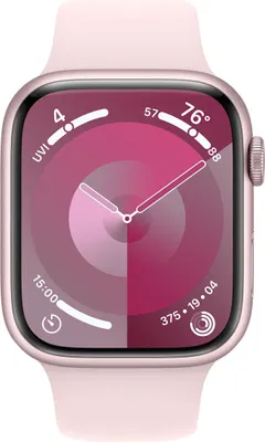 A close-up, front-facing shot of a rose gold Apple Watch Series 9 with a pink sport band, displaying its watch face with various complications.