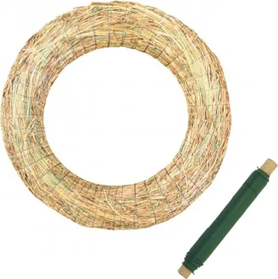 A straw wreath and a roll of green floral wire on a white background.