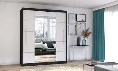 A modern bedroom or living room with a large sliding door wardrobe, a console table with decorative items, and teal curtains.
