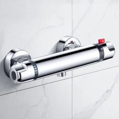 Immagine prodotto di Miscelatore termostatico per doccia con pulsante di sicurezza, adatto a temperature fino a 38 °C, in ottone.