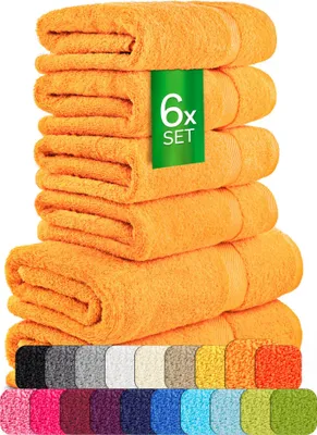 A stack of folded orange towels with a green label indicating '6x SET'. Below the towels, a row of different colored fabric swatches is displayed.
