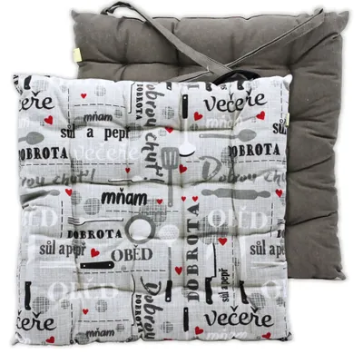 Two seat cushions are shown, one on top of the other. The top cushion has a patterned fabric with kitchen-related illustrations and text. The bottom cushion is a solid gray color.