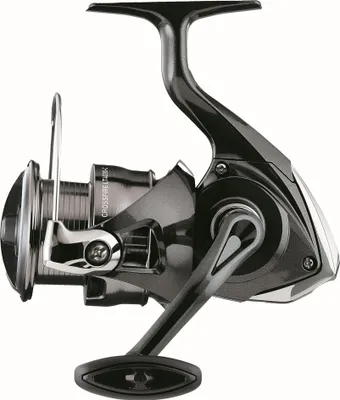 A studio shot of a fishing reel against a white background.