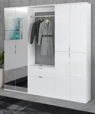 A white high-gloss hallway wardrobe with a mirrored door and a painting on the left side. Two coats are hanging inside the open section.