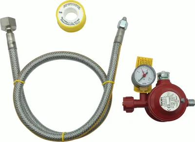A gas regulator set with a pressure gauge and a flexible hose, along with a roll of sealing tape, arranged on a white background.