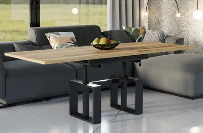 A modern living room with a sofa, coffee table, and ottoman.