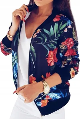 A woman wearing a floral bomber jacket.