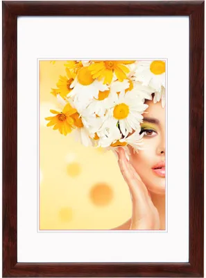 A framed portrait of a woman with flowers in her hair.