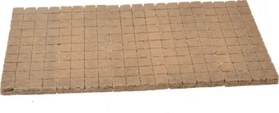 A flat lay of many small, square fire starters arranged in a grid pattern.