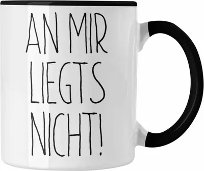 Produktbild von Trendation - An Mir Liegts Nicht Tasse Geschenk für Arbeit Büro Kollegen (Schwarz)