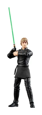 A Star Wars action figure of Luke Skywalker holding a green lightsaber.