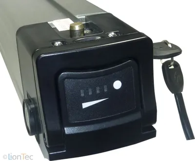 A close-up view of an e-bike battery pack with a key and a charge indicator.