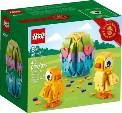 The image shows the packaging of a LEGO Easter Chicks building toy set, with the product displayed on a green grassy background with a blue sky and clouds.