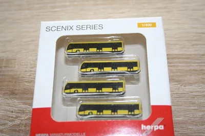 Zdjęcie produktu dla 4 Żółty autobus lotniskowy, HER562591, skala 1/400, HERPA
