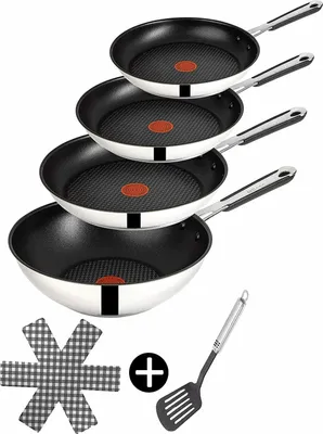 A stack of four Tefal frying pans and a wok, along with a spatula and a pan protector.
