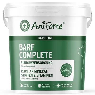 A white plastic tub of AniForte Barf Complete dog food supplement, with green labeling and graphics.