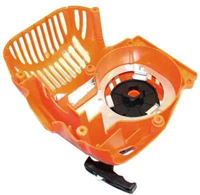 An orange plastic starter housing with a black pull cord handle and a silver metal plate.