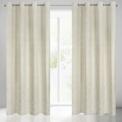 Two cream-colored curtains hanging in front of a window.