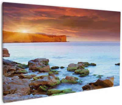 Produktbild von Wallario Premium Leinwandbild Sonnenaufgang am Meer mit Landzunge und Felsen im Wasser in Größe 60 x 90 cm
