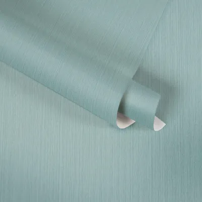 A roll of teal textured wallpaper is shown, with a portion unrolled.