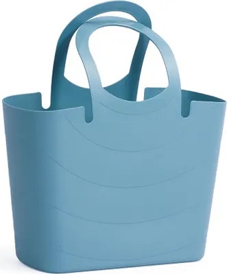 A blue tote bag with curved lines on its side and two handles.