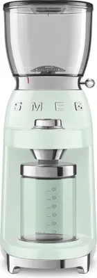A front view of a pastel green Smeg coffee grinder on a white background.