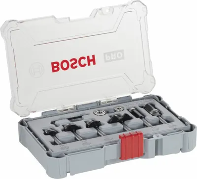 A set of router bits in a gray plastic case with a clear lid.